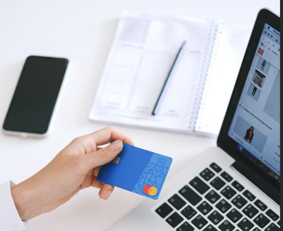 Business person with credit card doing B2B commerce